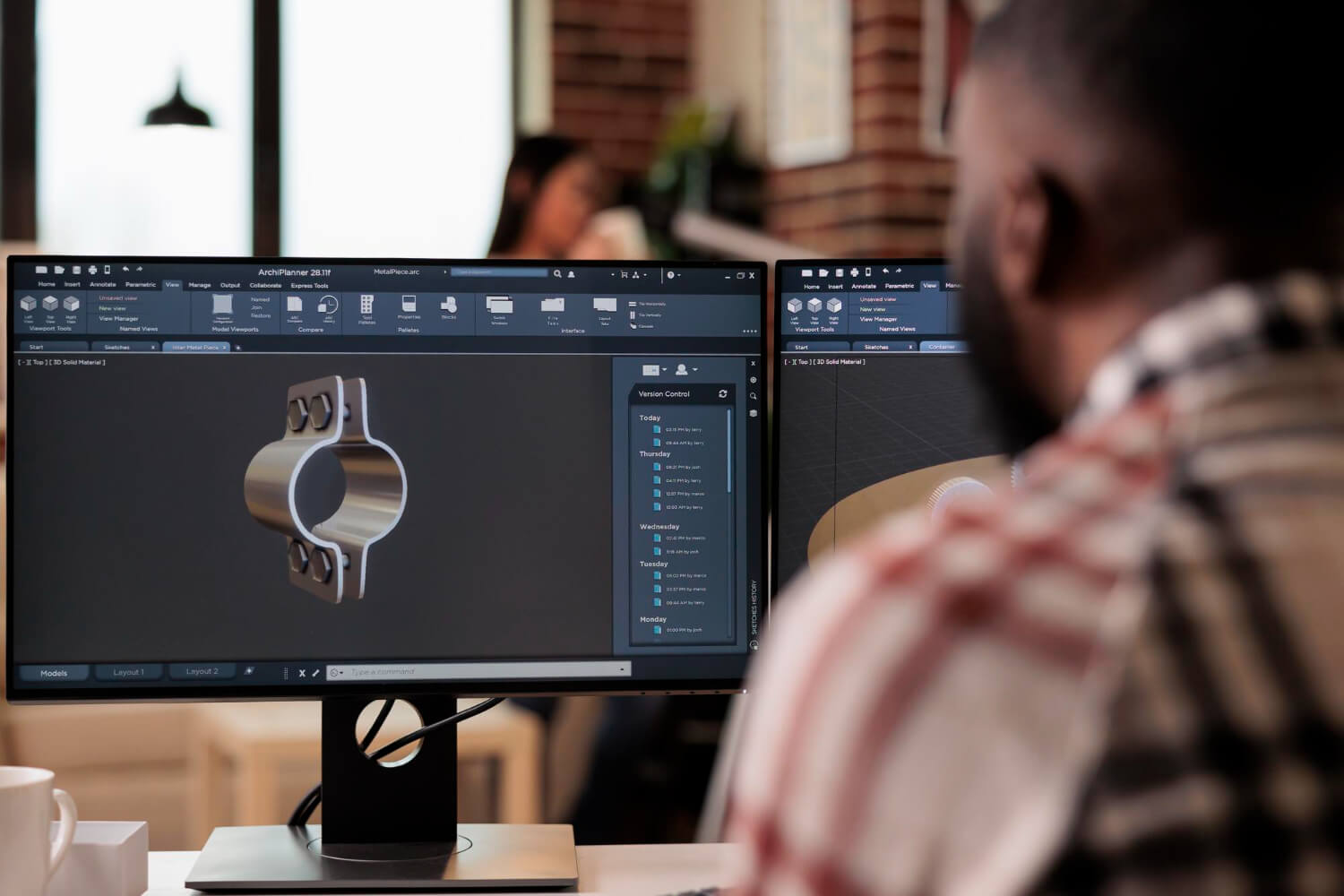 cad-engineer-looking-at-a-3d-model-on-a-computer-screen